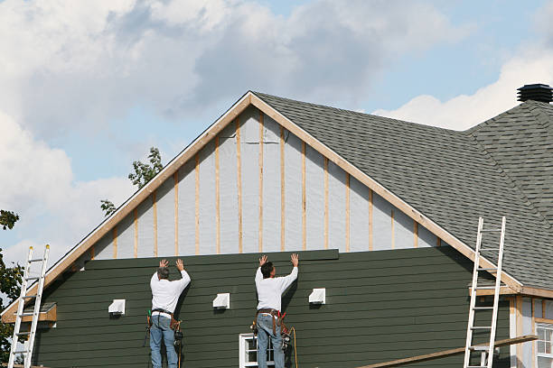 Professional Siding technician working in White Stone, VA